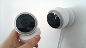 two security cameras one handheld